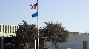 US and TOTO flags outside headquarters