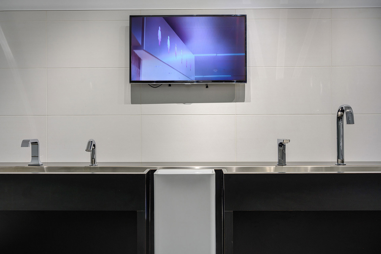 Faucets on display in front of video screen