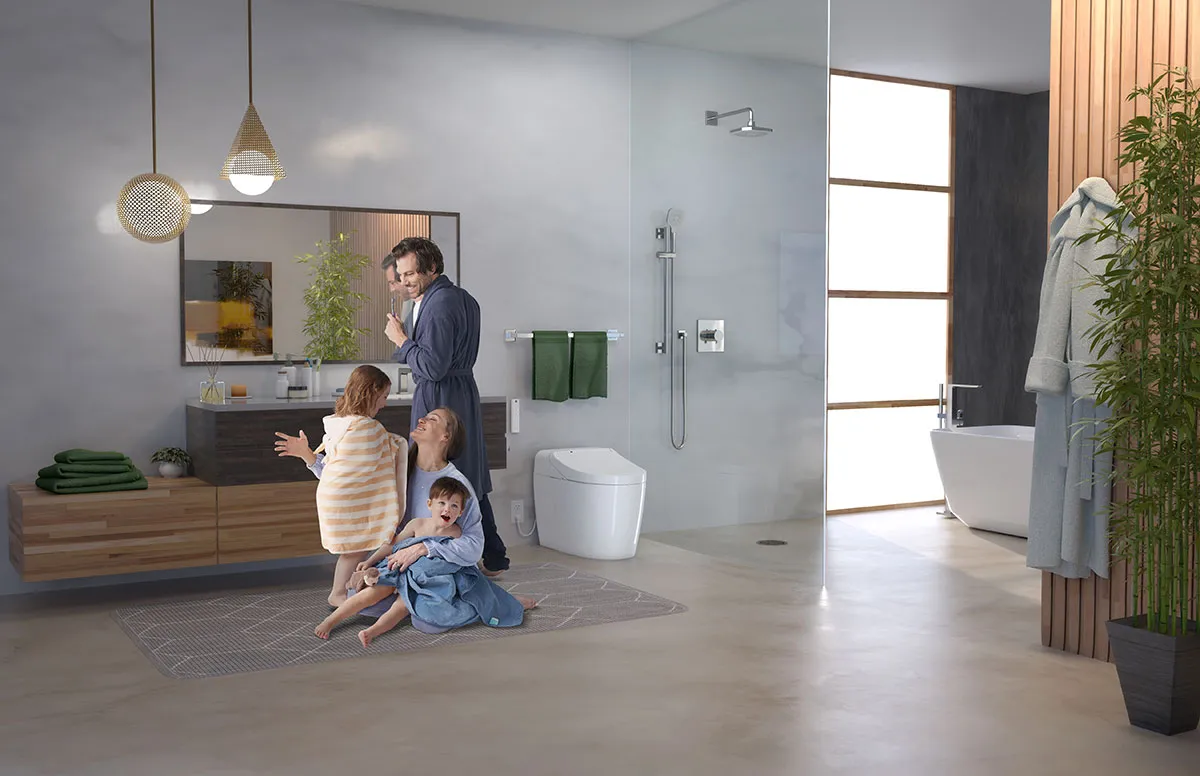A family spends time together in a bright, open bathroom featuring an integrated bidet toilet, glass shower, and natural accents.