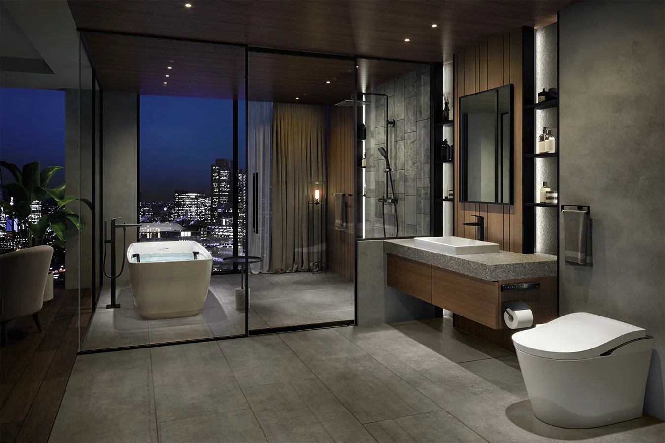 This is a soothing bathroom encased in glass as if blending into the view of the skyscrapers. A touch of sharpness is added to the interior, in a greyish tone with wooden accents, by the black faucets and curves of the toilet.