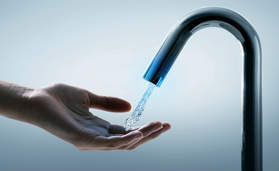 Hand with Touchless automatic faucet
